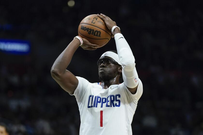 Clippers guard Reggie Jackson shoots against the Golden State Warriors on Nov. 28, 2021.