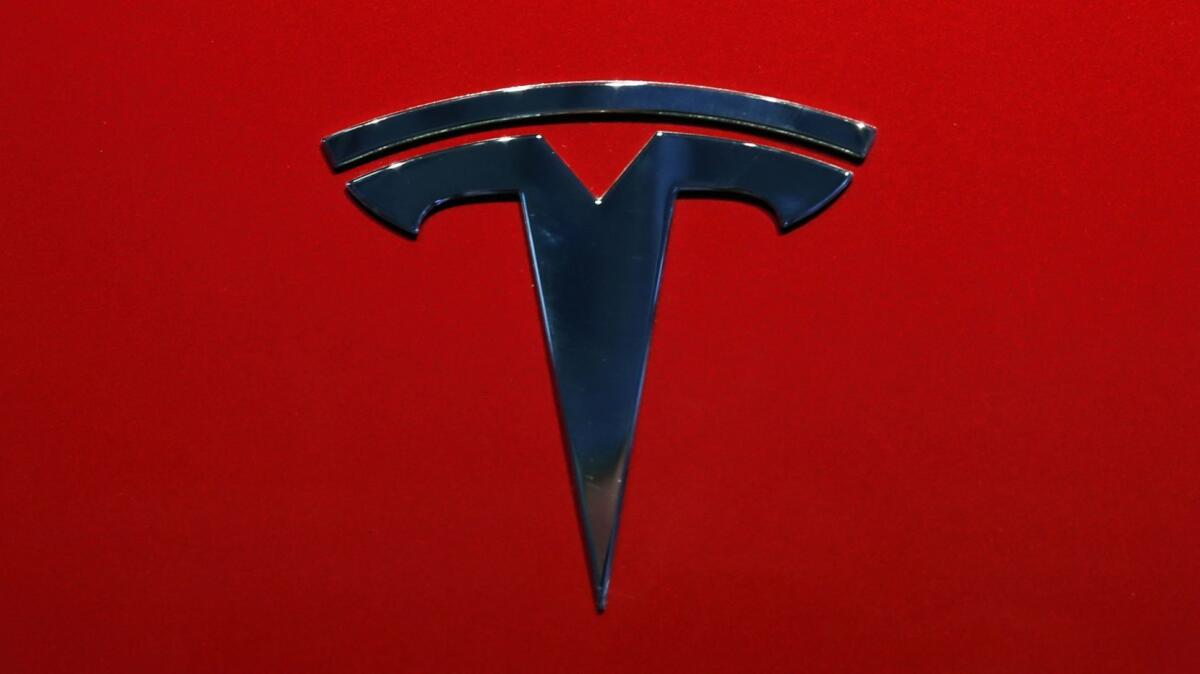 Tesla's stock sank Friday after CEO Elon Musk called for a “hardcore” review of all the company’s expenses and an analyst warned of potentially severe fallout from a fatal crash involving Autopilot.