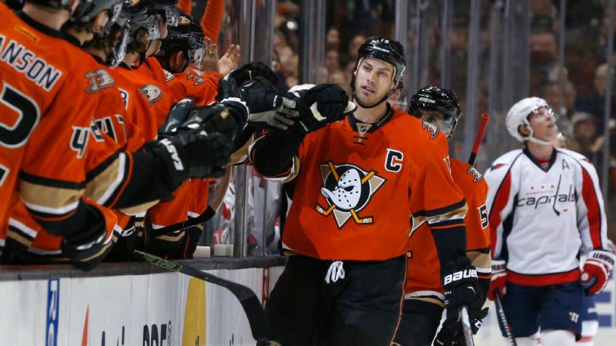 Ducks captain Ryan Getzlaf celebrates with his teammates after scoring a goal on the Capitals during a game on March 7.