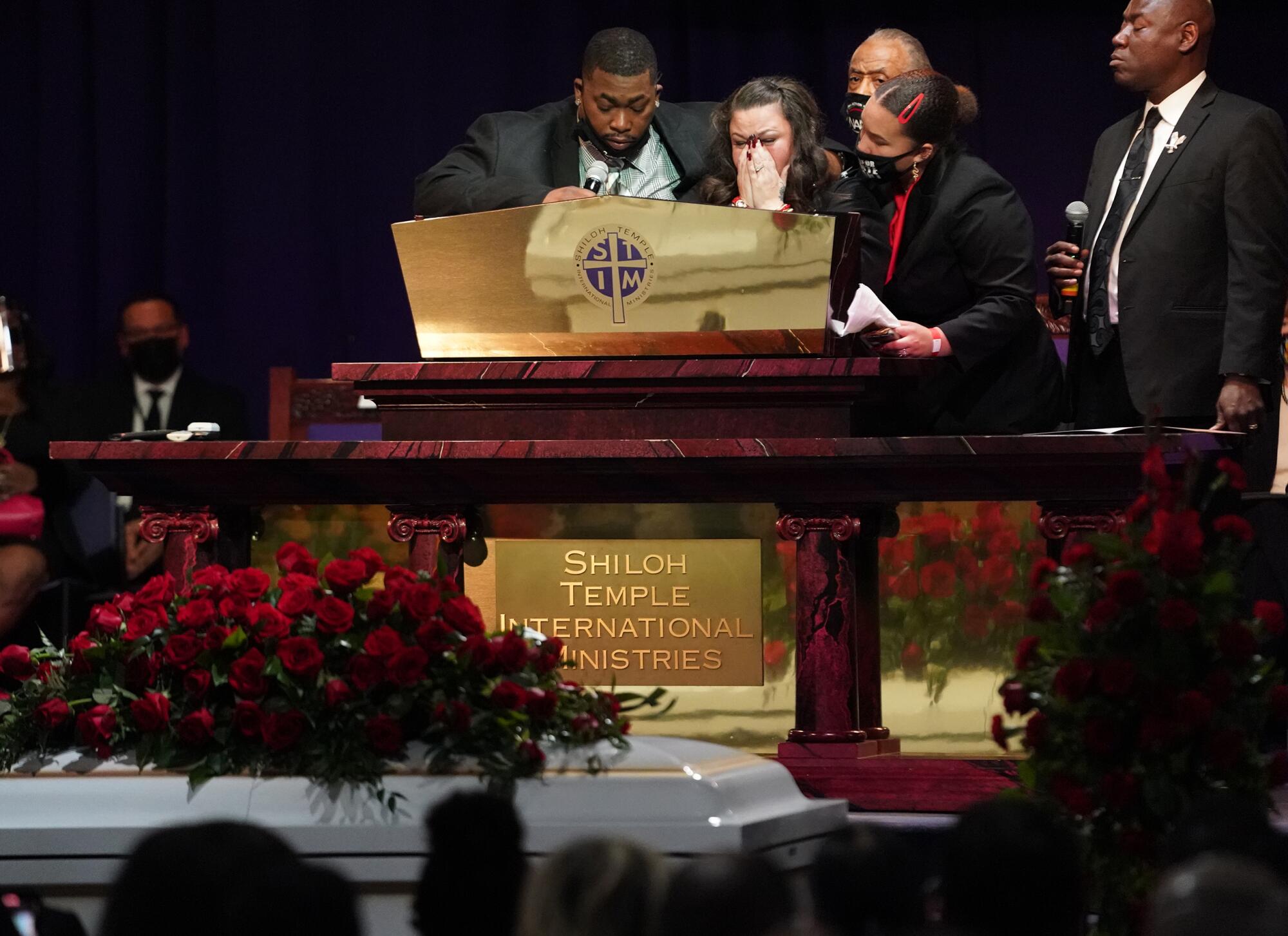 Katie Wright, mother of Daunte Wright, center, at her sons funeral. 