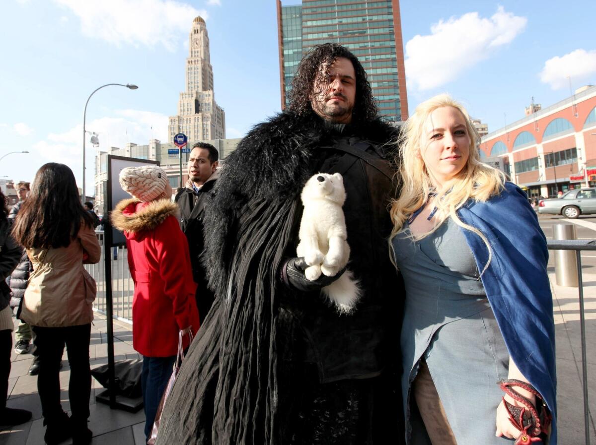 Cosplayers dressed as Jon Snow and Daenerys Targaryen attend the "Game of Thrones" fan experience at Barclays Center in New York.