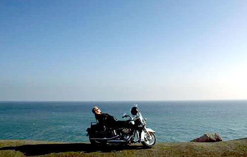 A rider has a quiet moment atop a 700-pound Harley Davidson motorcycle at Point Mugu.