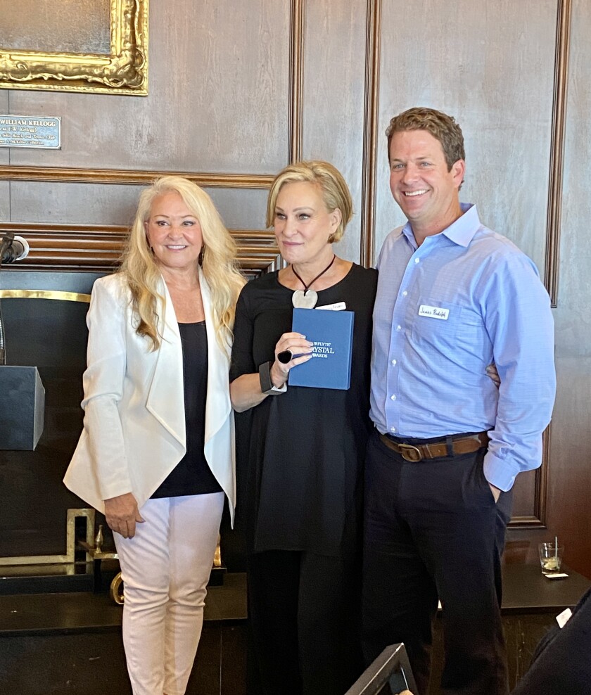 Jerri Hunt (left) and James Rudolph flank Sherry Ahern, one of the Hometown Heroes honored by the La Jolla Town Council.