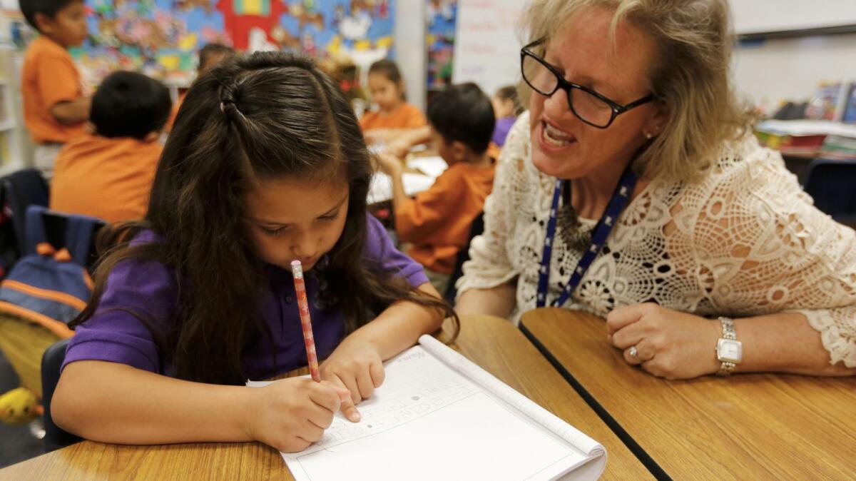 Whittingham works one-on-one with Giuliana. By the end of February, she had managed to reach grade level, mastering 50 words.