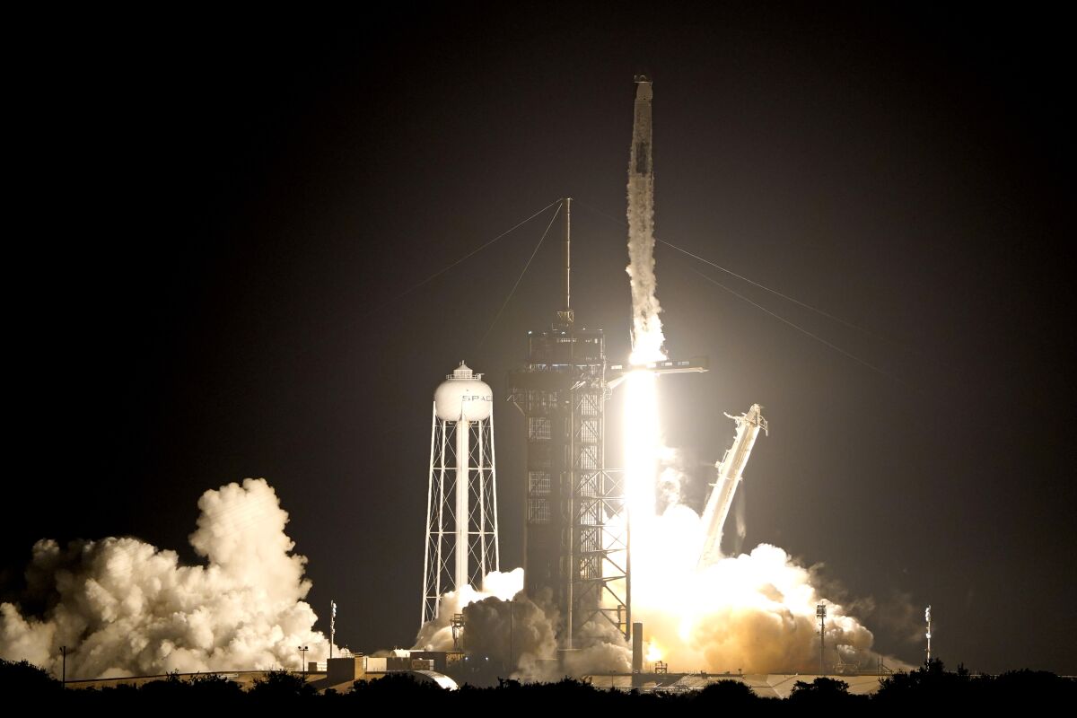 A SpaceX Falcon 9 rocket with the Crew Dragon capsule lifts off from Launch Pad 39A at the Kennedy Space Center in Cape Canaveral, Fla., Wednesday, Nov. 10, 2021. (AP Photo/John Raoux)
