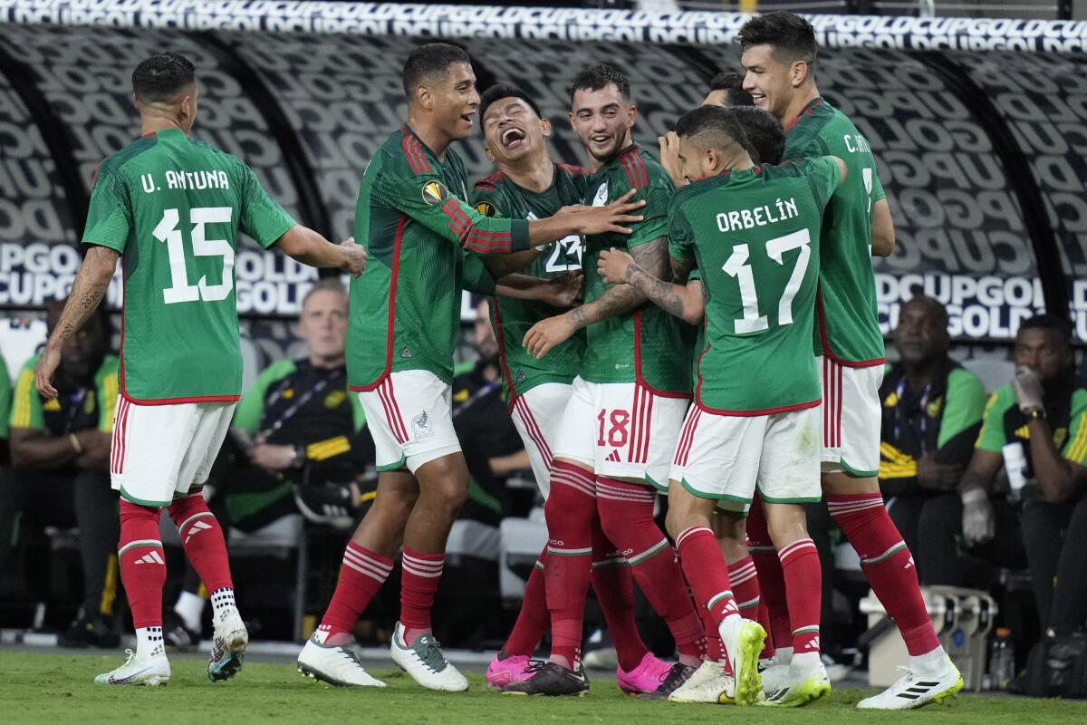 Mexico players celebrate after Luis Chavez scored against Jamaica.
