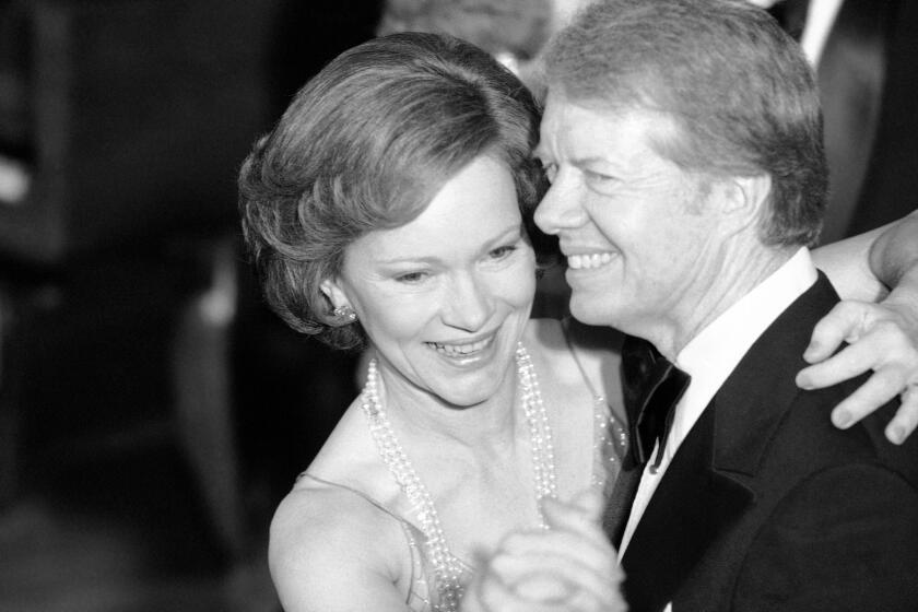 FILE - In this Dec. 13, 1978 file photo, President Jimmy Carter and his wife Rosalynn lead their guests in dancing at the annual Congressional Christmas Ball at the White House in Washington. Jimmy Carter and his wife Rosalynn celebrate their 75th anniversary this week on Thursday, July 7, 2021. (AP Photo/Ira Schwarz, File)