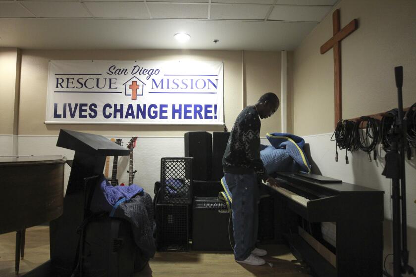 San Diego Rescue Mission Academy student and resident Bruce Calimee, 56, who will soon graduate, plays an electric piano while in the dinning area at the San Diego Rescue Mission on Thursday, September 26, 2019 in San Diego, California.