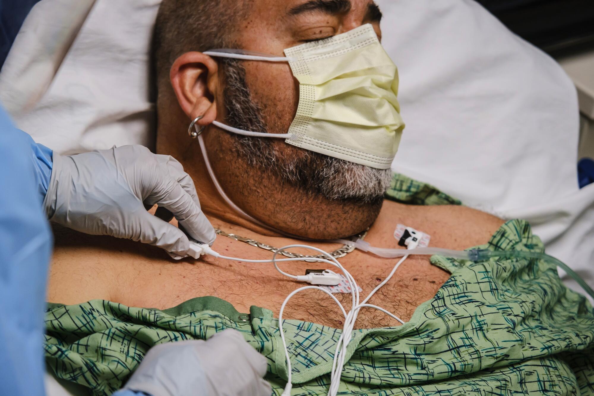 Nurse checks patient's vital signs