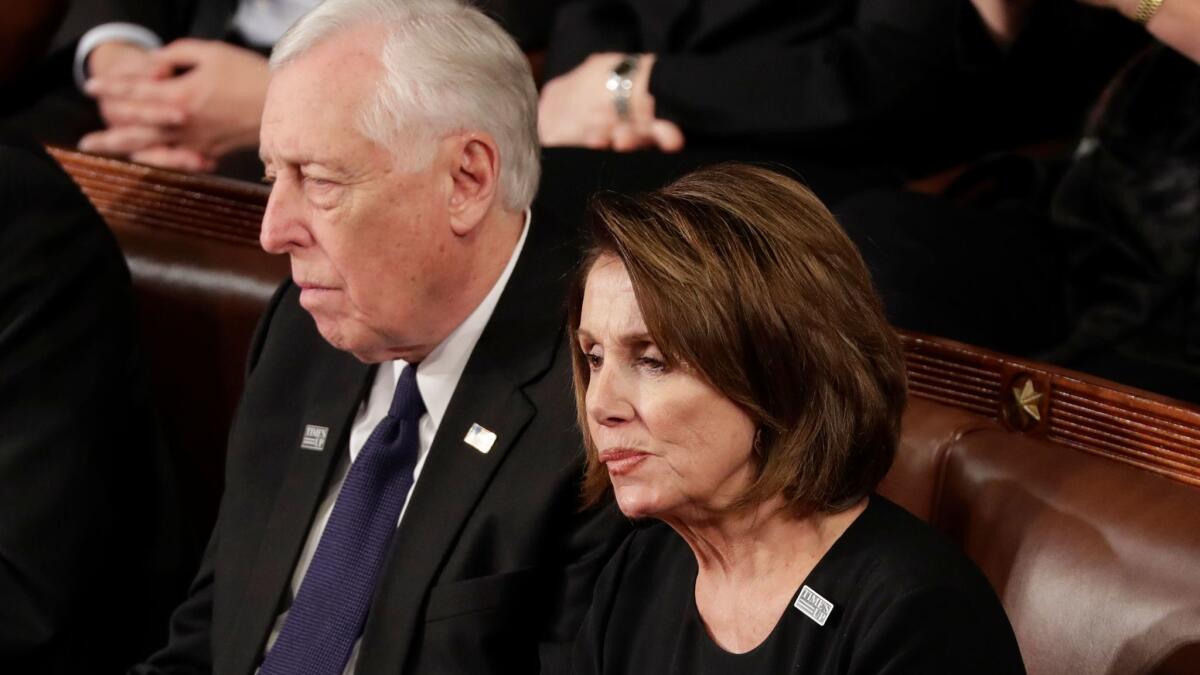 House Minority Leader Nancy Pelosi listens to President Trump's State of the Union speech with Minority Whip Steny Hoyer.