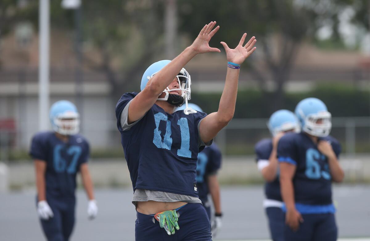 Mark Redman, pictured working out at Corona del Mar's Aug. 8 practice, has committed as a tight end to the University of Washington.