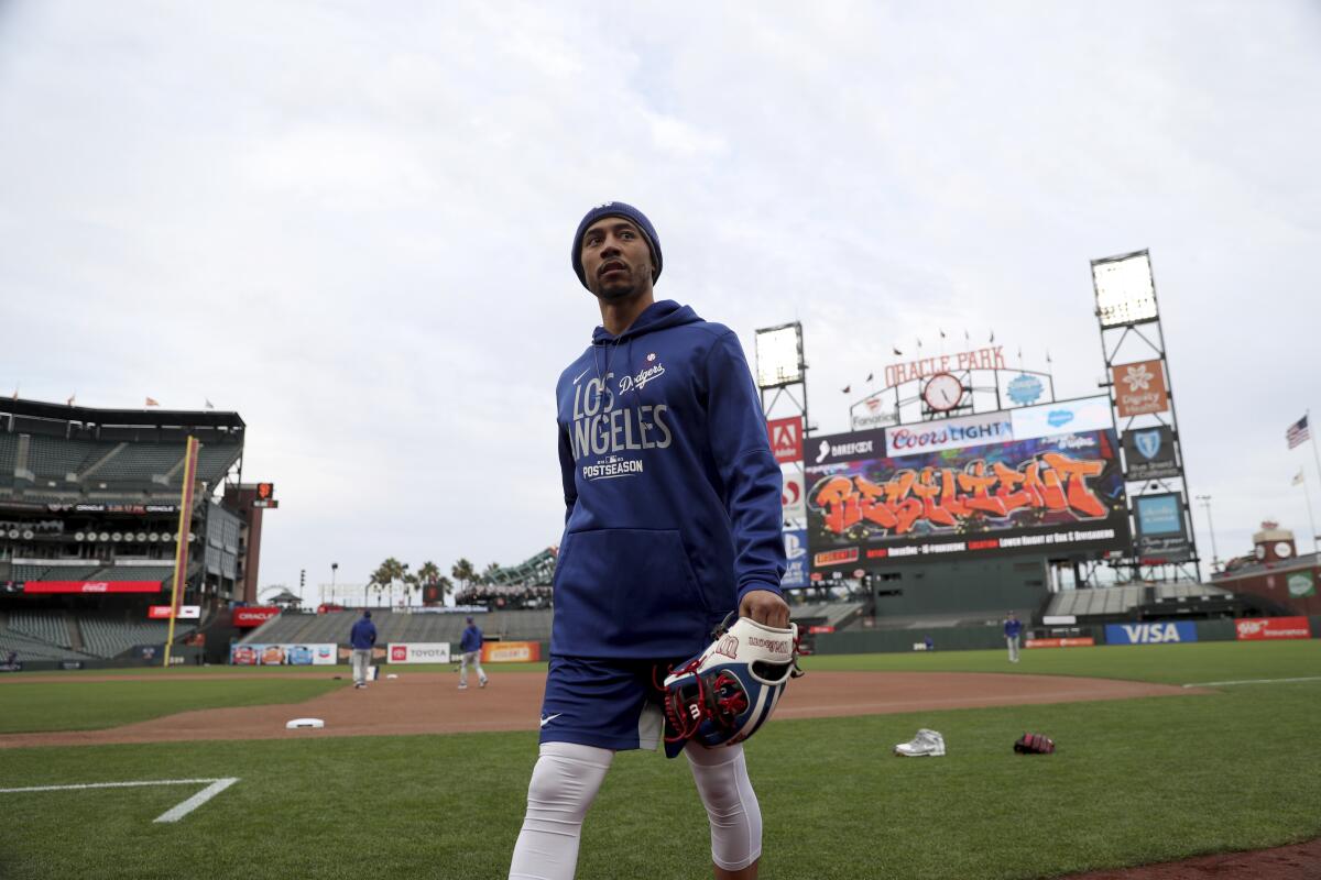 Dodgers right fielder Mookie Betts walks on the field at Oracle Park during a team workout on Thursday.