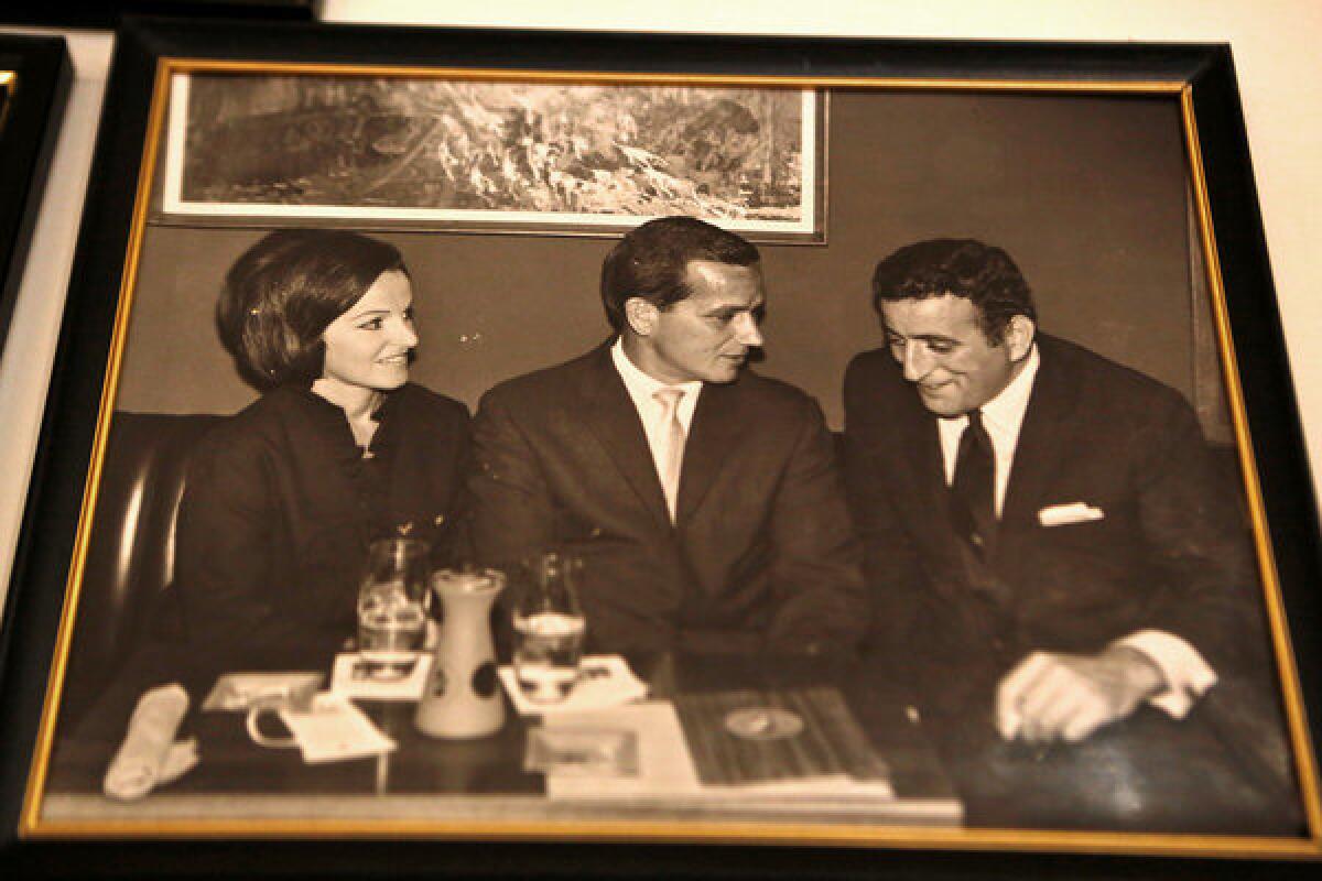 A photo from a different era shows Chuck Cecil, center, with his wife, Edna, and crooner Tony Bennett, who has called Cecil "a great jazz historian."