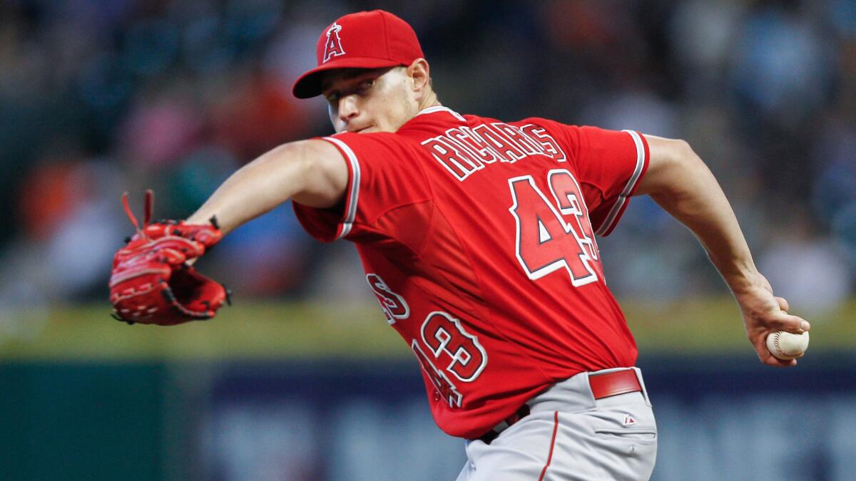 Angels starter Garrett Richards delivers a pitch during the first inning of a 4-3 loss to the Houston Astros on Sunday.