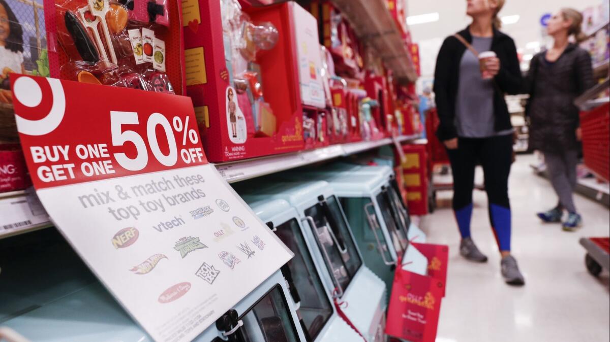 Shoppers browse the aisles during a Black Friday sale at a Target store