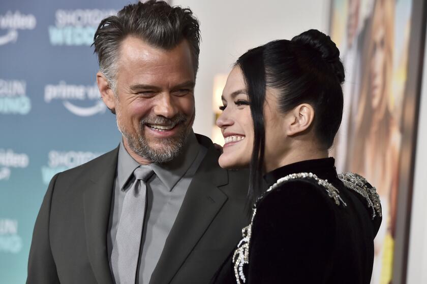 Josh Duhamel, left, and Audra Mari arrive at the premiere of "Shotgun Wedding," Wednesday, Jan. 18, 2023, at TCL Chinese Theatre in Los Angeles. (Photo by Jordan Strauss/Invision/AP)