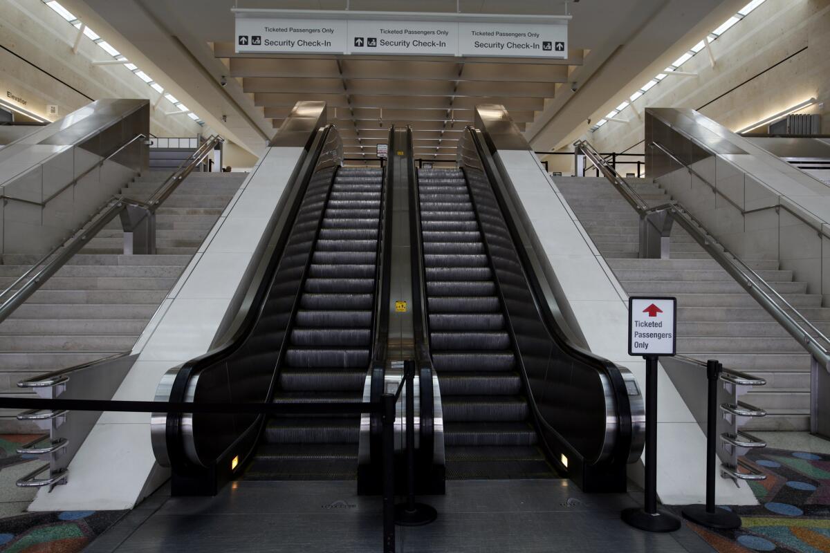 The escalators leading to the security check-in at LA/Ontario International Airport Terminal 2.