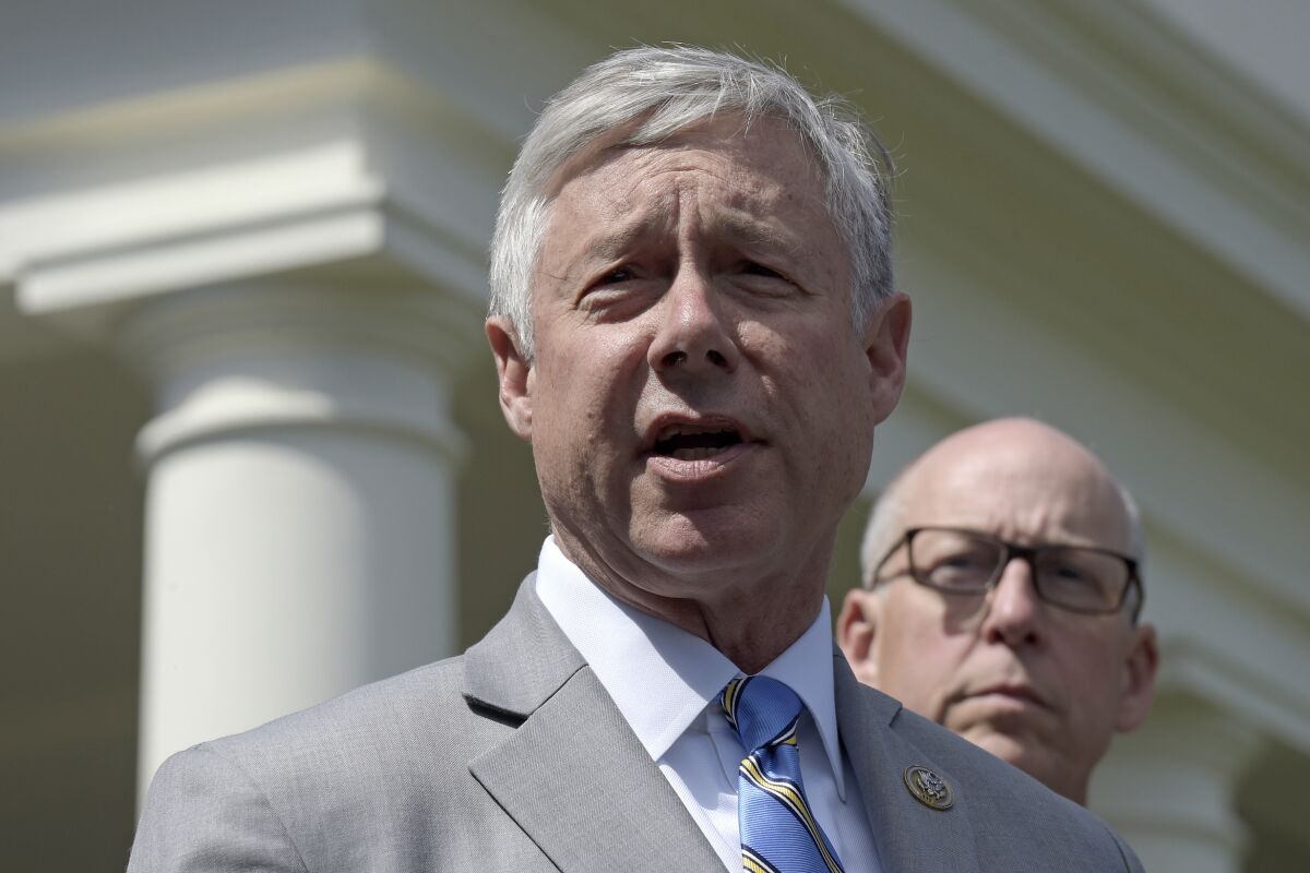 FILE -Rep. Fred Upton, R-Mich., left, speaks to reporters outside the White House in Washington, May 3, 2017. Upton, who voted to impeach President Donald Trump over the Capitol insurrection, announced Tuesday, April 5, 2022, that he's retiring after 35 years in office. (AP Photo/Susan Walsh, File)