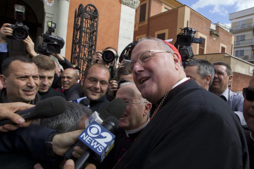 Cardinal Timothy Dolan of New York arrives at Nostra Signora di Guadalupe church in Rome on Sunday to celebrate Mass.