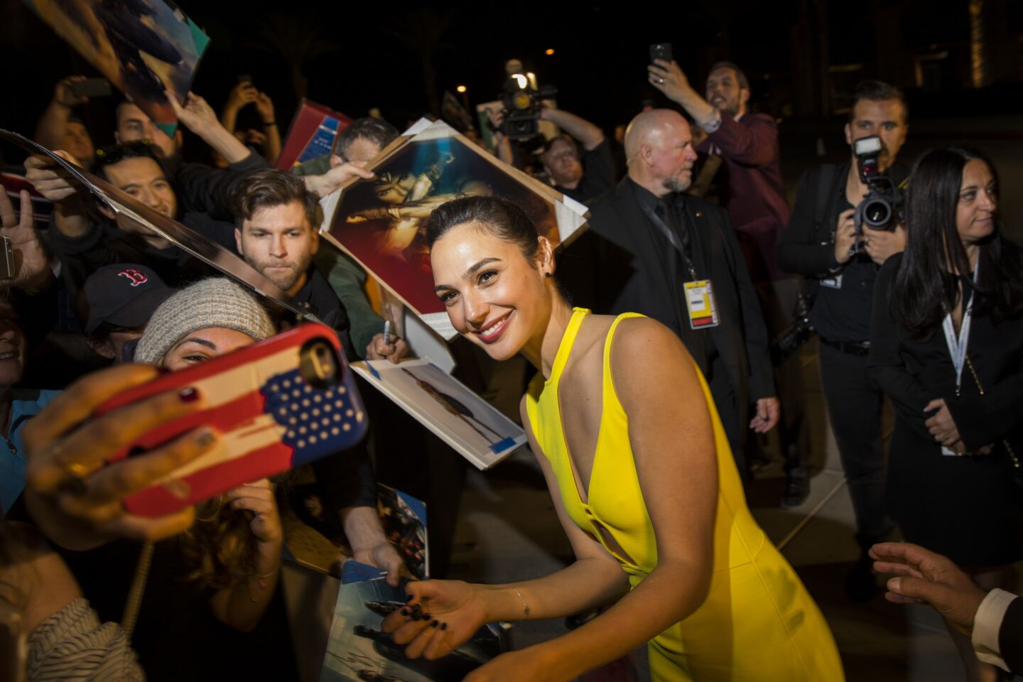 "Wonder Woman's" Gal Gadot signs autographs and takes pictures with fans before stepping on the red carpet at the 18th annual Palm Springs International Film Festival Gala on Tuesday. Gadot received the female Rising Star Award.