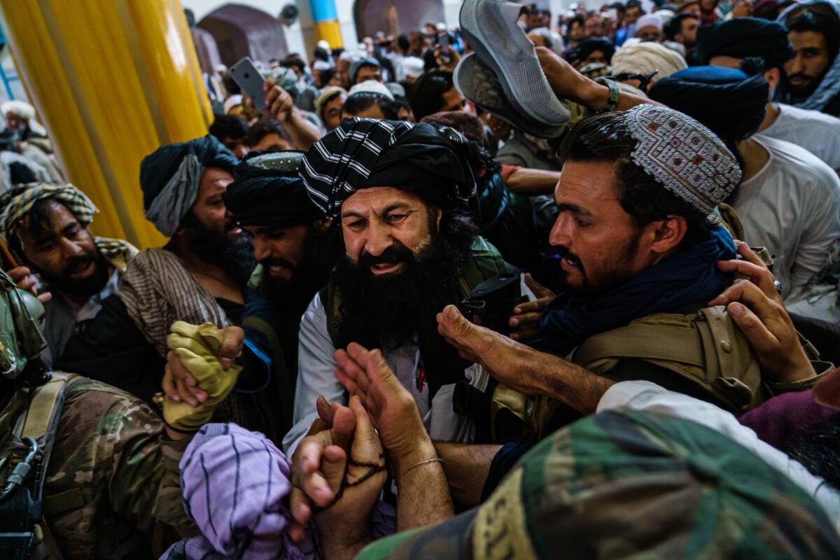 A crush of men at an Afghan mosque