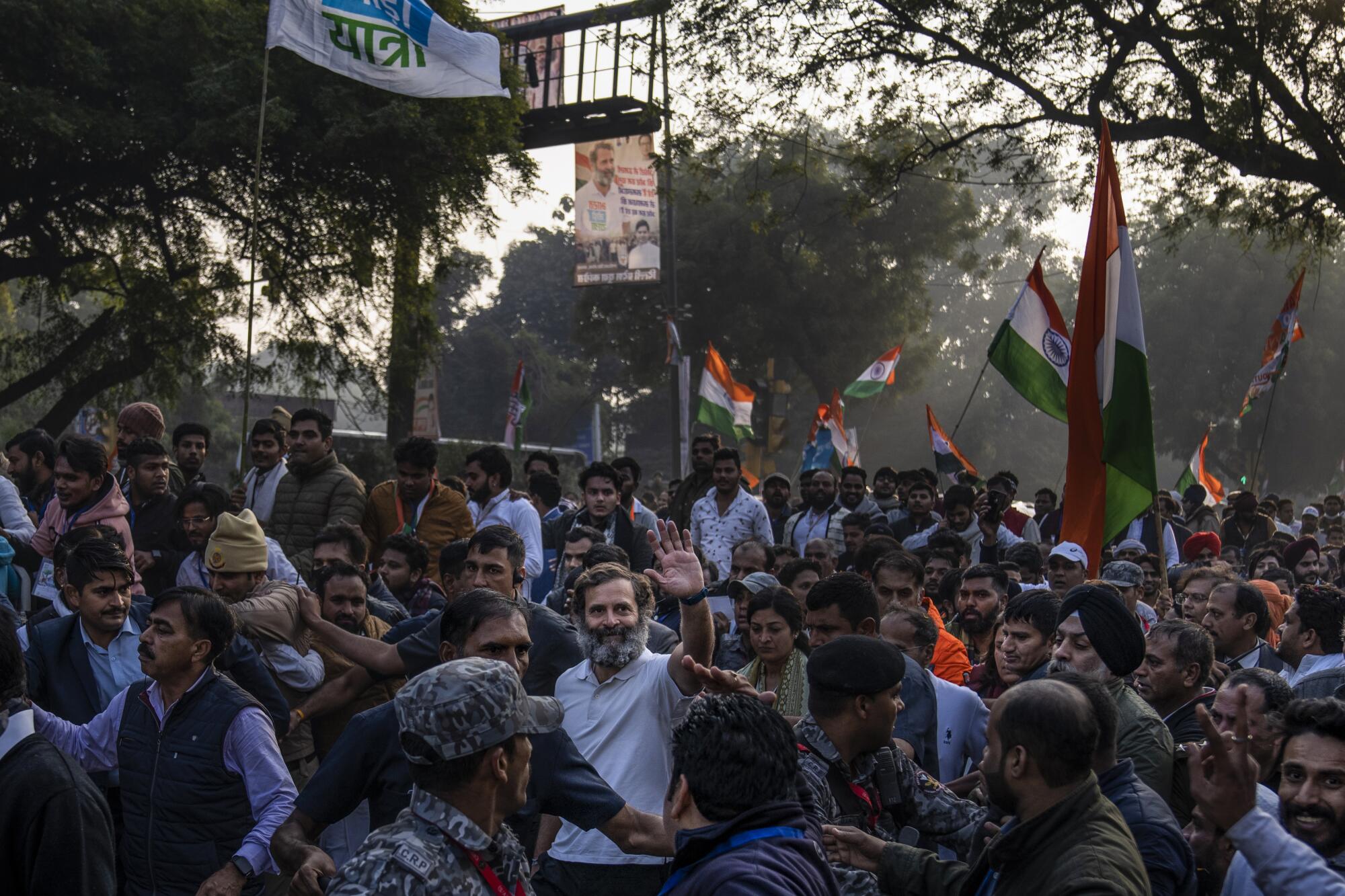 Rahul Gandhi waves to his supporters in New Delhi