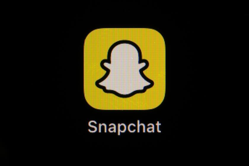The icon for instant messaging app Snapchat is seen on a smartphone, Feb. 28, 2023, in Marple Township, Pa. The owner of Snapchat is cutting approximately 10% of its worldwide workforce, or about 528 employees, just the latest tech company to announce layoffs. Snap Inc. said in a regulatory filing that it currently estimates $55 million to $75 million in charges, mostly for severance and related costs. (AP Photo/Matt Slocum)