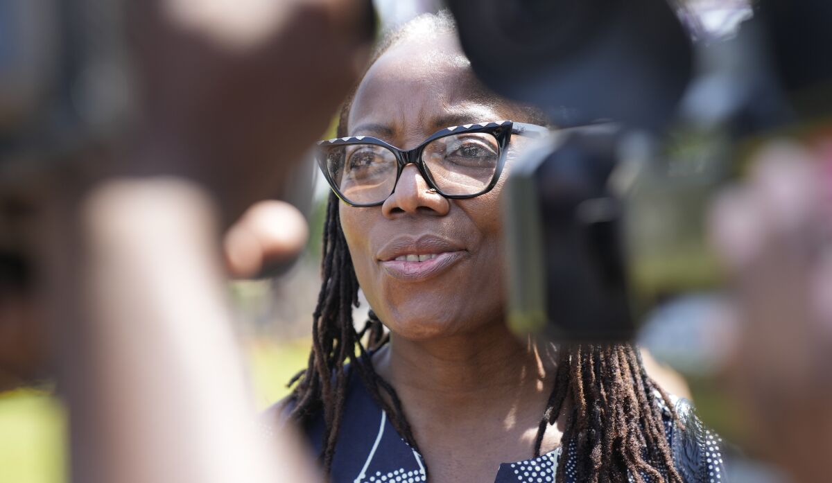 Zimbabwean writer Tsitsi Dangarembga talks to the press upon arrival at the magistrates courts for judgment in her court case in Harare, Thursday, Sept. 29, 2022. Dangarembga faces charges of inciting public violence for protesting against corruption and the rule of law in Zimbabwe.(AP Photo/Tsvangirayi Mukwazhi)