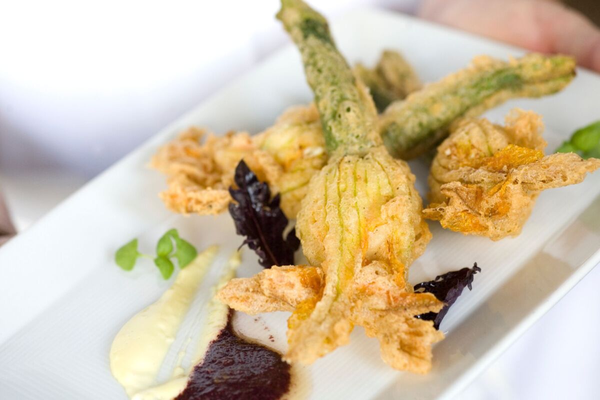 The stuffed squash blossoms at Cucina are among the most deliciously delicate appetizers in town. 