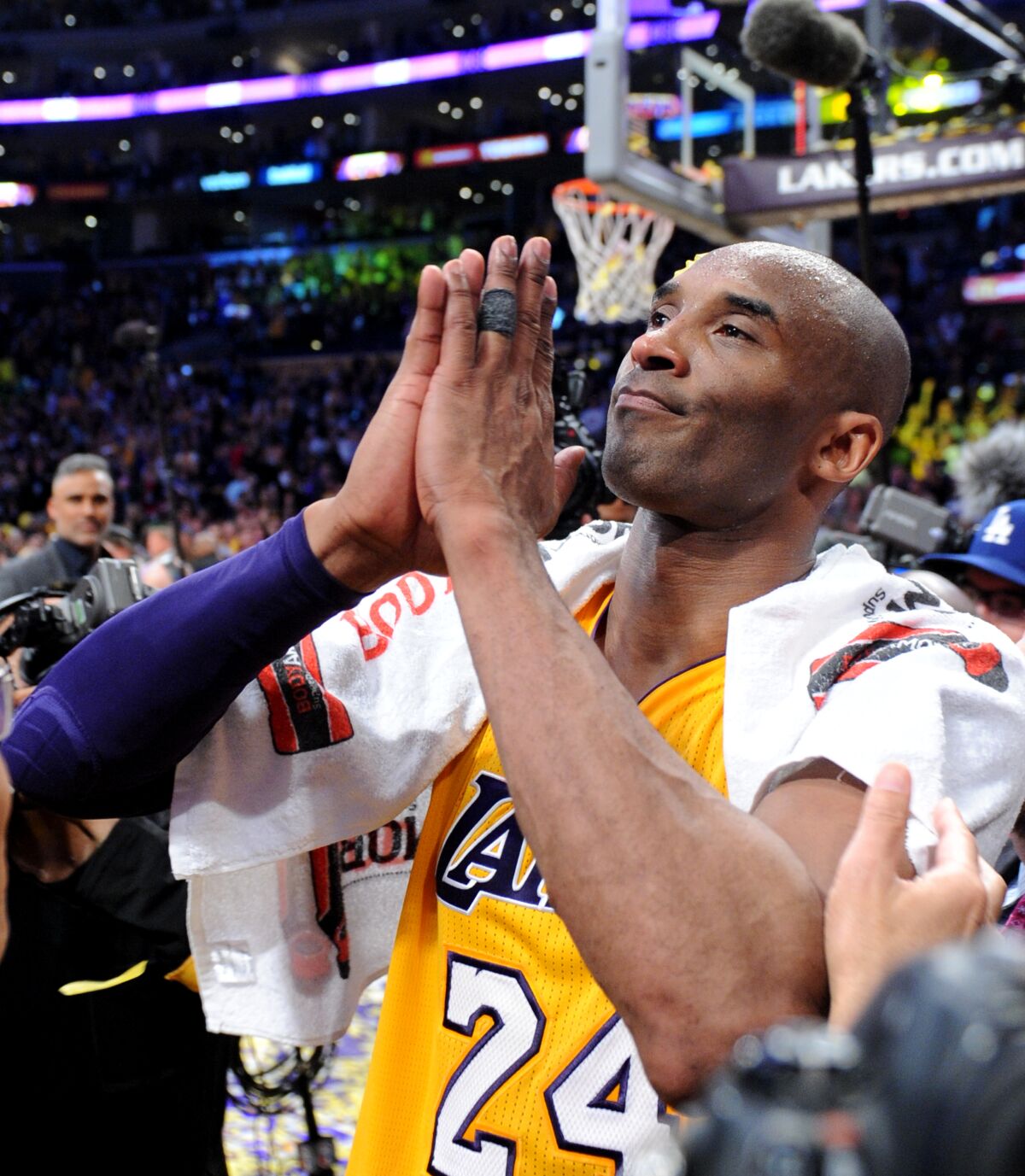 Lakers star Kobe Bryant gestures toward the crowd at Staples Center following the final game of his career on April 13, 2016.