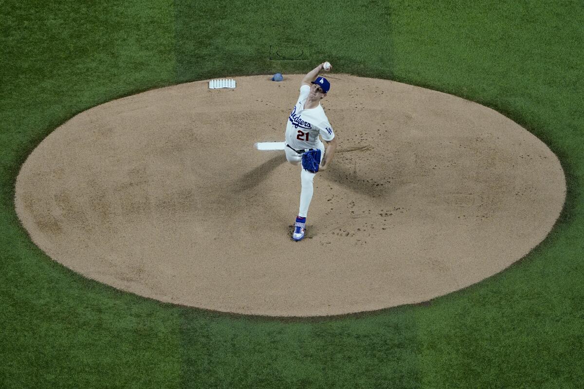 Los Angeles Dodgers starting pitcher Walker Buehler throws against the Atlanta Braves.