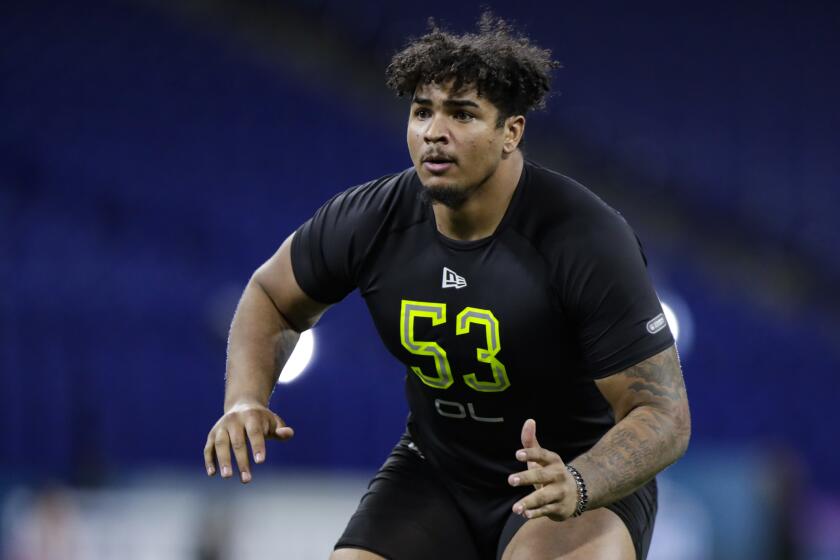 Iowa offensive lineman Tristan Wirfs runs a drill at the NFL football scouting combine in Indianapolis, Friday, Feb. 28, 2020. (AP Photo/Michael Conroy)