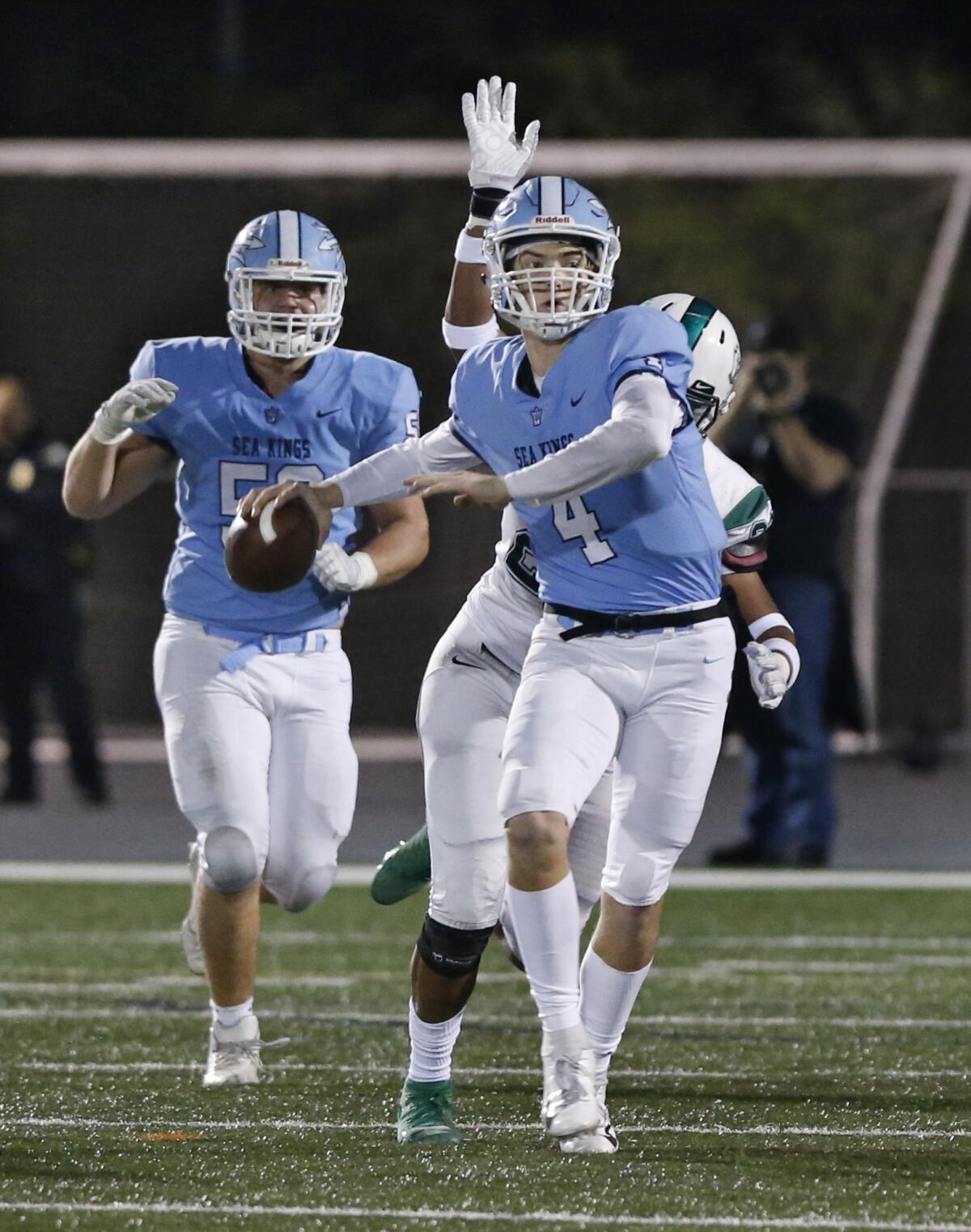 Corona del Mar's Ethan Garbers avoids the rush in the CIF State Southern California Regional Division 1-A Bowl Game against Oceanside on Dec. 7 at Newport Harbor High.