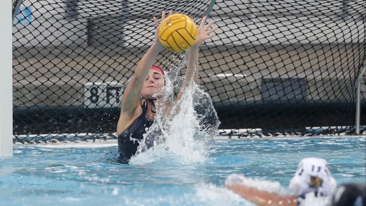 Marina goalkeeper Emma Marsh makes a save against Costa Mesa during the second half of a nonleague match on Dec. 12, 2018.