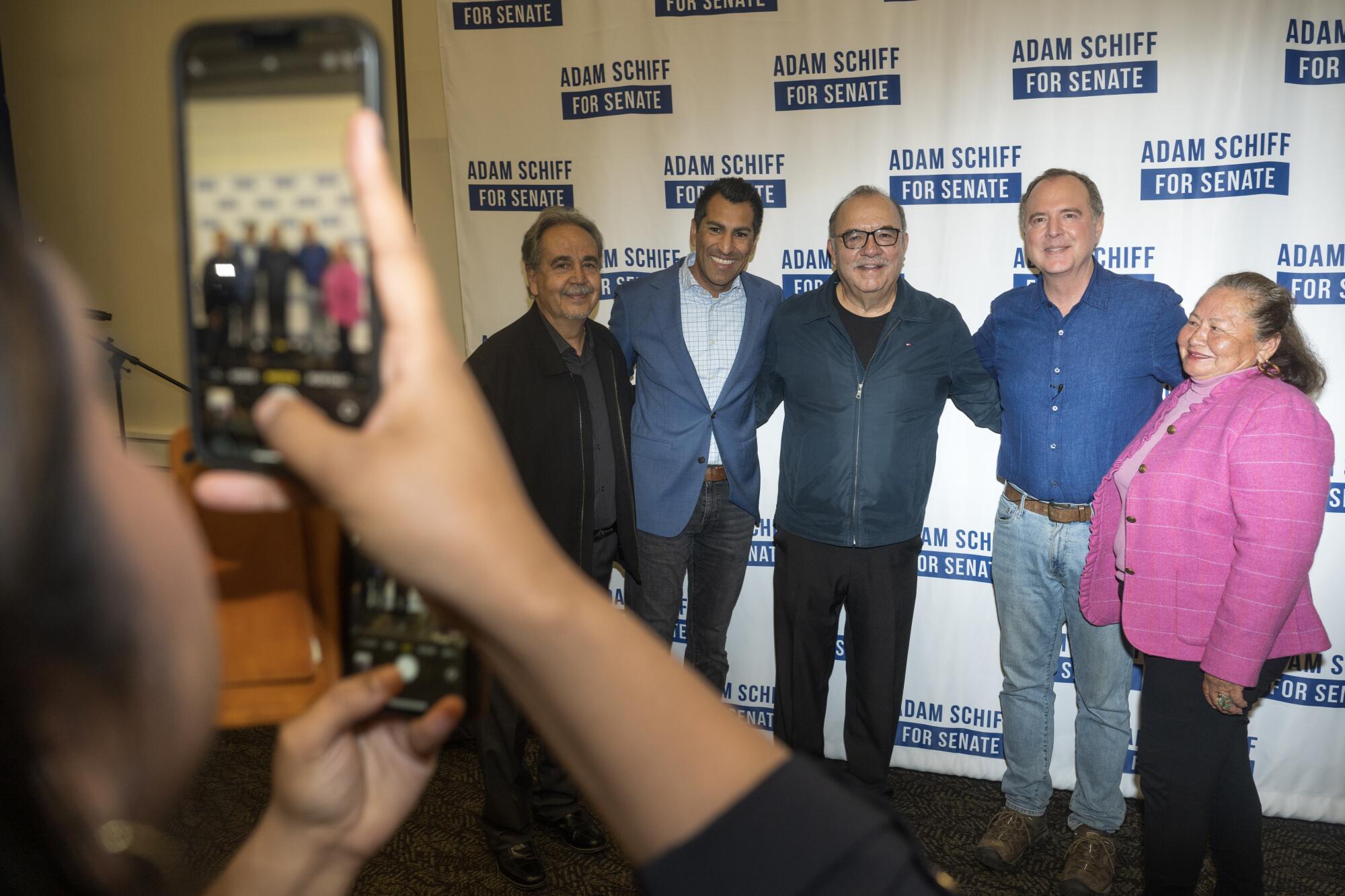 U.S. Senate candidate Adam Schiff poses with supporters