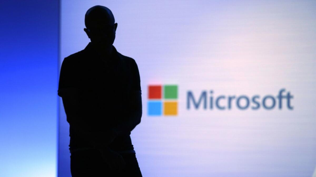 Microsoft CEO Satya Nadella looks on during a video as he delivers the keynote address at Build, the company's annual conference for software developers. Microsoft and IBM have grabbed 51% of the more than $700-million market for blockchain products and services.