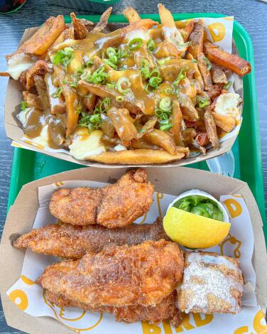 Japanese poutine, above, and chicken tenders with a biscuit and pickles from Go Go Bird