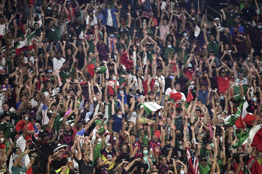 Soccer fans cheer during the first half of the CONCACAF Gold Cup final between the U.S. and Mexico