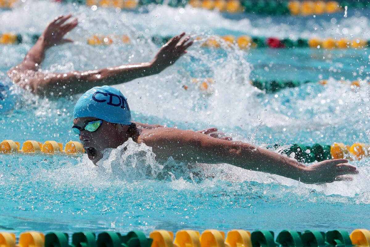 Corona del Mar senior Jake Kubichek competes in the boys' 200 individual medley during the Surf League swim finals.
