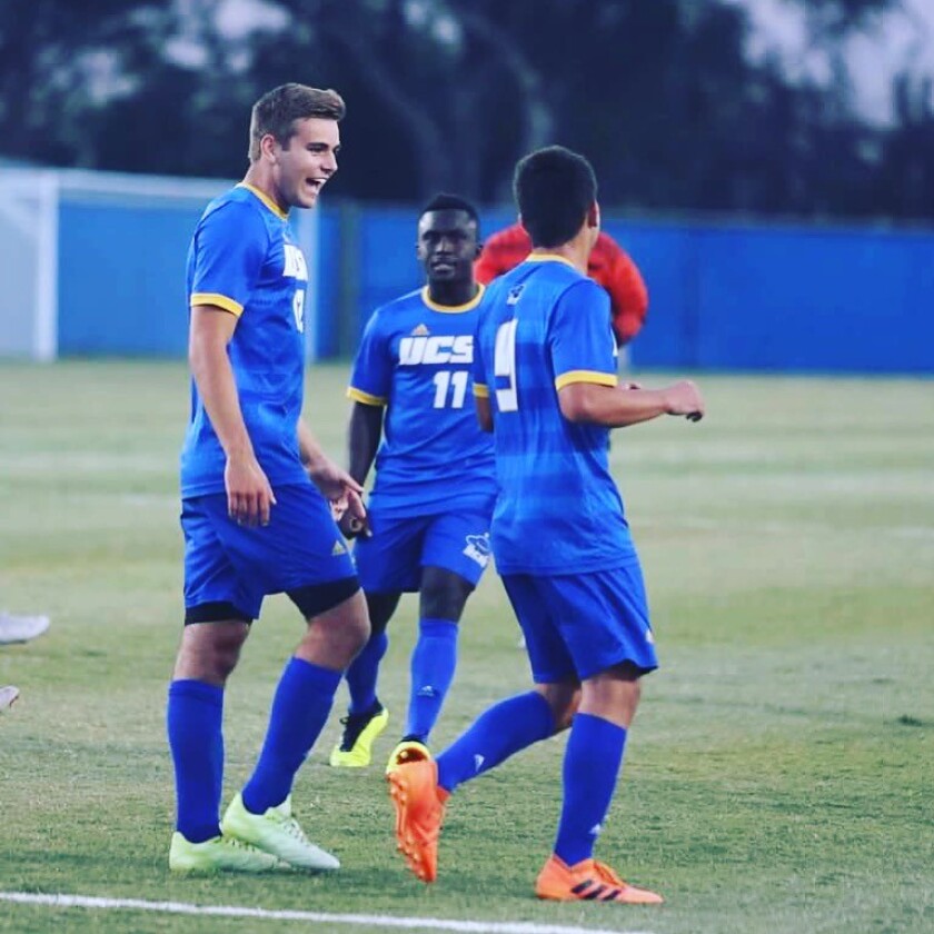 UCSB soccer's Carson Vom Steeg with teammates during a game.