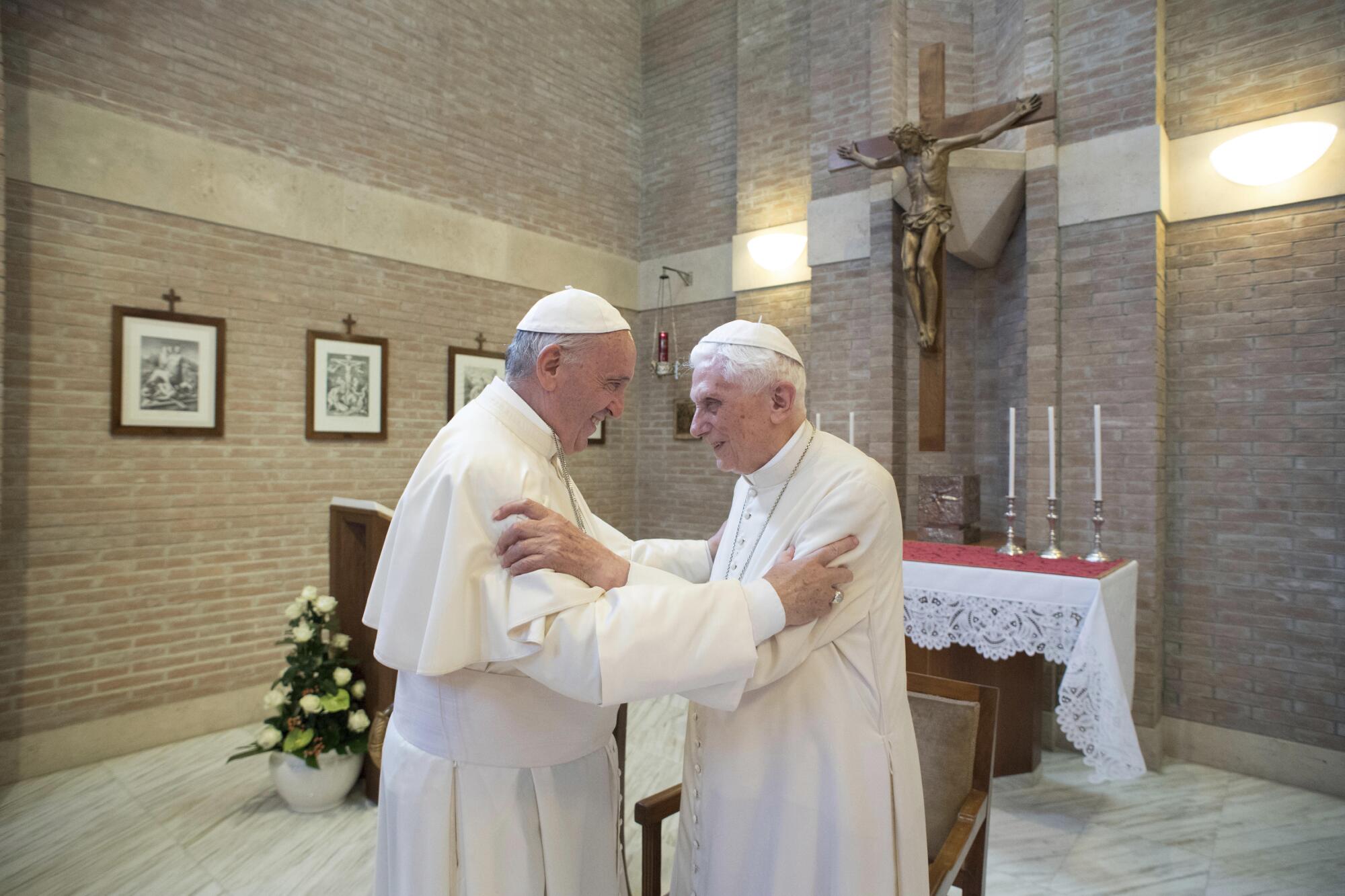 Pope Francis embraces Pope Emeritus Benedict XVI at the Vatican. 