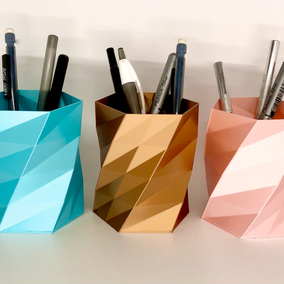Three pen holders with a geometric design
