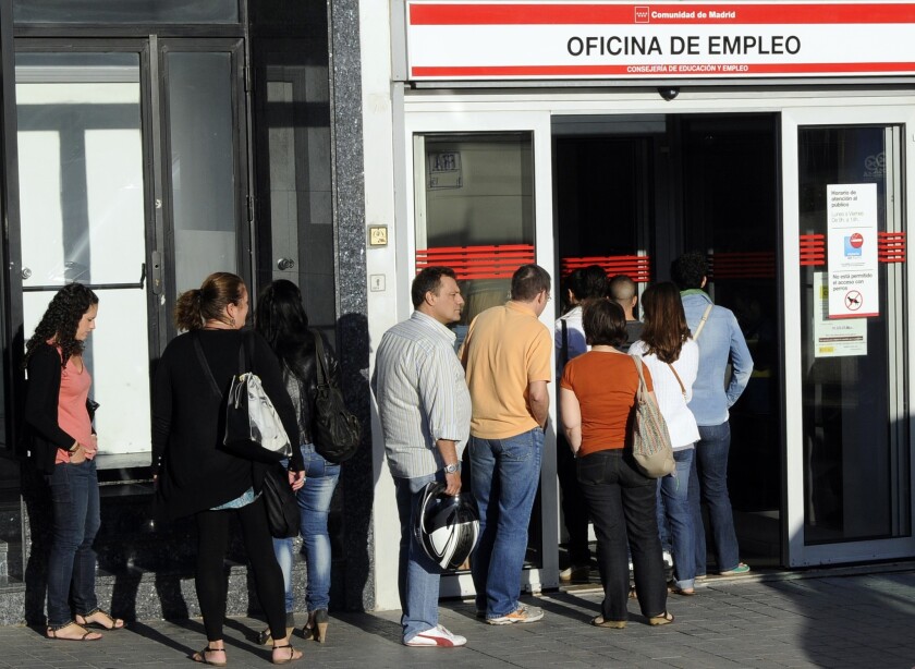 Lines for filing jobless claims in Spain, as at this benefits office in Madrid in September, won't get much shorter because of November's 0.05% dip in unemployment. But the economy appears to be moving in the right direction, officials say.