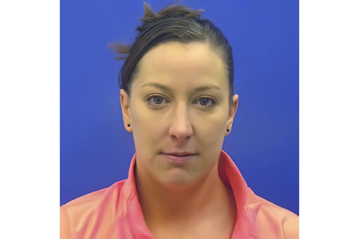 This driver's license photo from the Maryland Motor Vehicle Administration (MVA), provided to AP by the Calvert County Sheriff’s Office, shows Ashli Babbitt. Babbitt was fatally shot by an employee of the Capitol Police inside the U.S. Capitol building in Washington on Wednesday, Jan. 6, 2021, while the rioters were moving toward the House chamber. (Maryland MVA/Courtesy of the Calvert County Sheriff’s Office via AP)