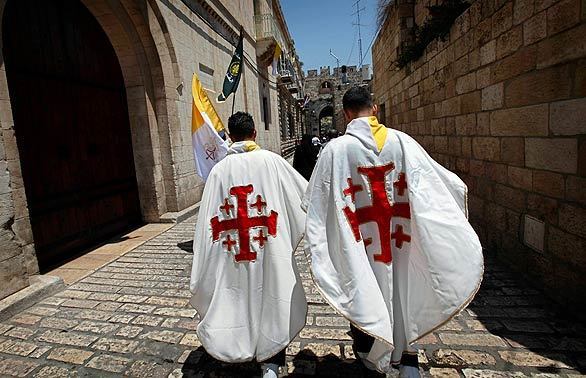 Christian youths make their way toward Mass, being held at Kidron Valley in Jerusalem's Old City. Fouad Twal, the Latin patriarch of Jerusalem, attended the Mass given by the pope in Kidron Valley.