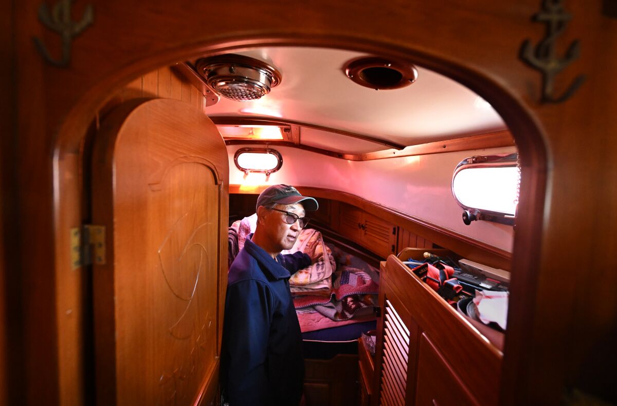 A man stands inside a yacht