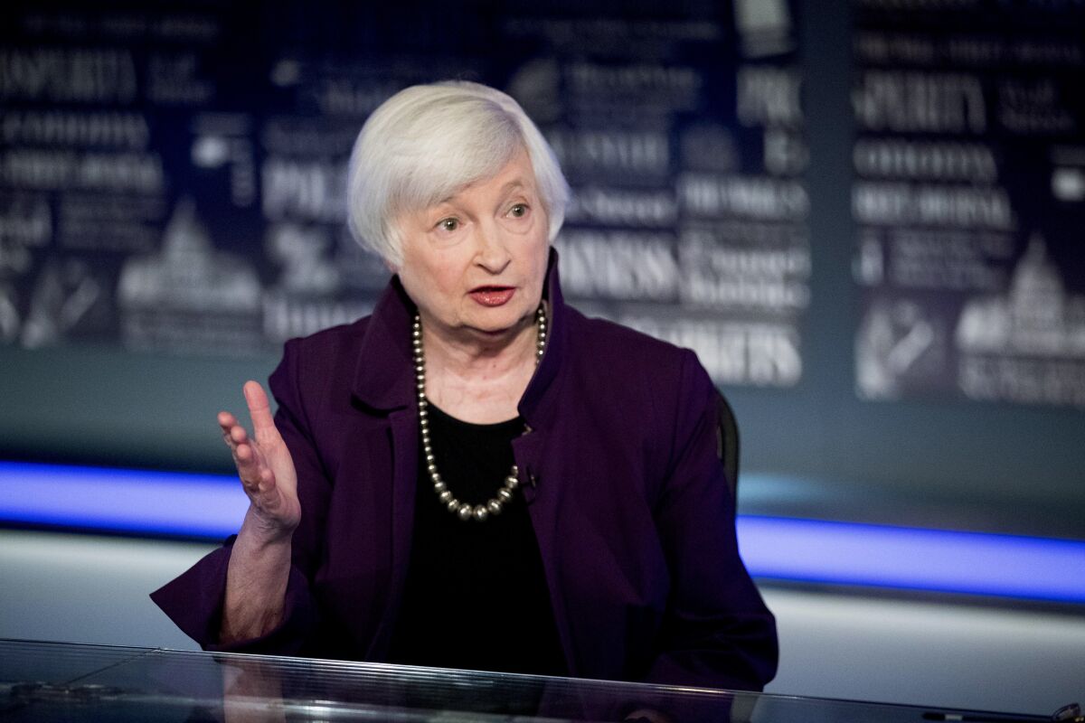 Janet Yellen gestures while speaking on a TV show