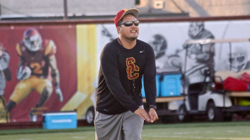 Tight ends coach Marques Tuiasosopo gives instruction during a USC fall practice in August.