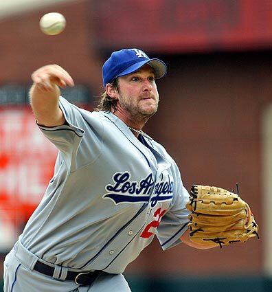 Dodgers pitcher Derek Lowe throws to the San Francisco Giants in the first inning.