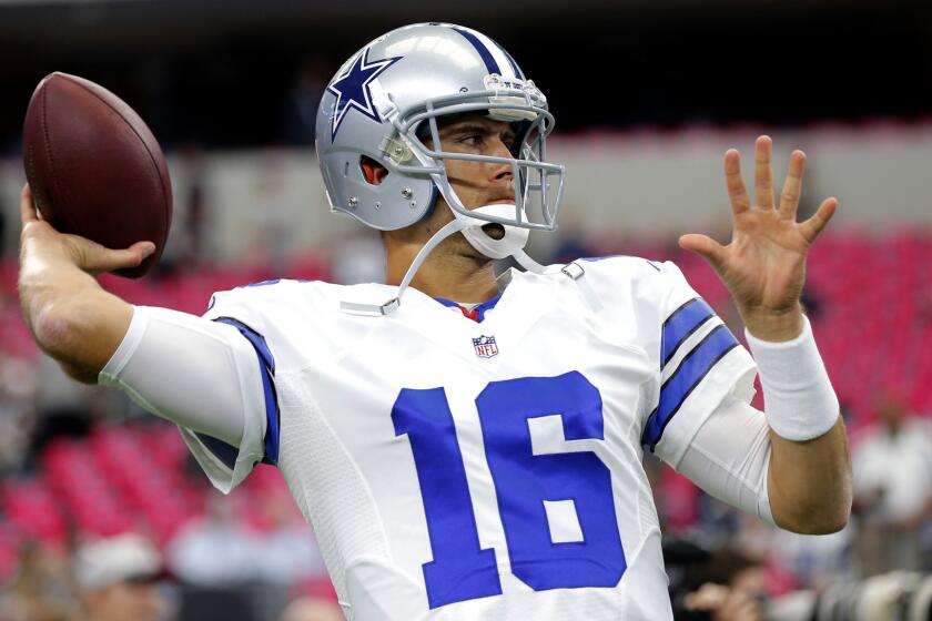Cowboys quarterback Matt Cassel (16) warms up before a game against the Patriots on Sunday.